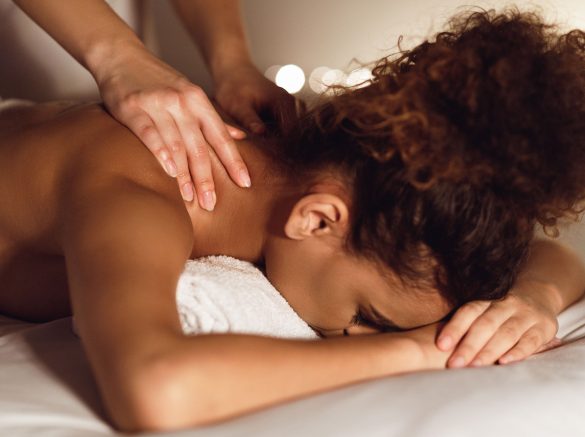 woman-enjoying-therapeutic-neck-massage-in-spa-GMDE84J.jpg